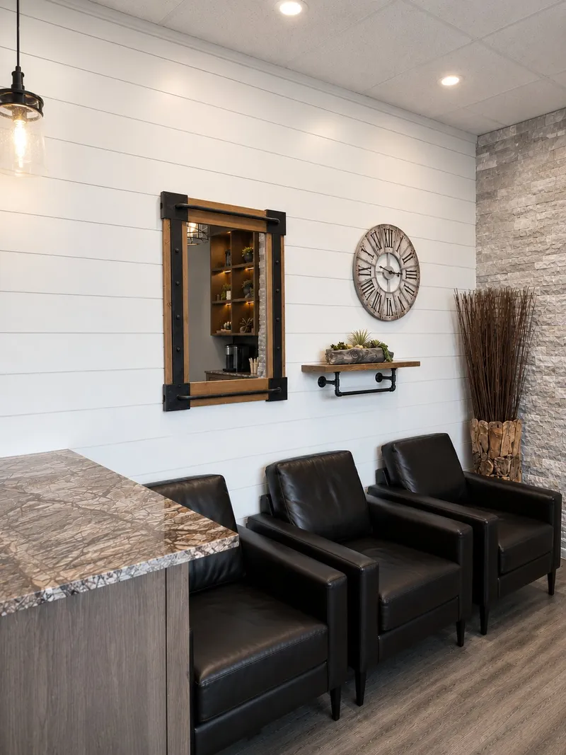 Waiting lounge at Maidstone Dental with leather chairs and shiplap walls