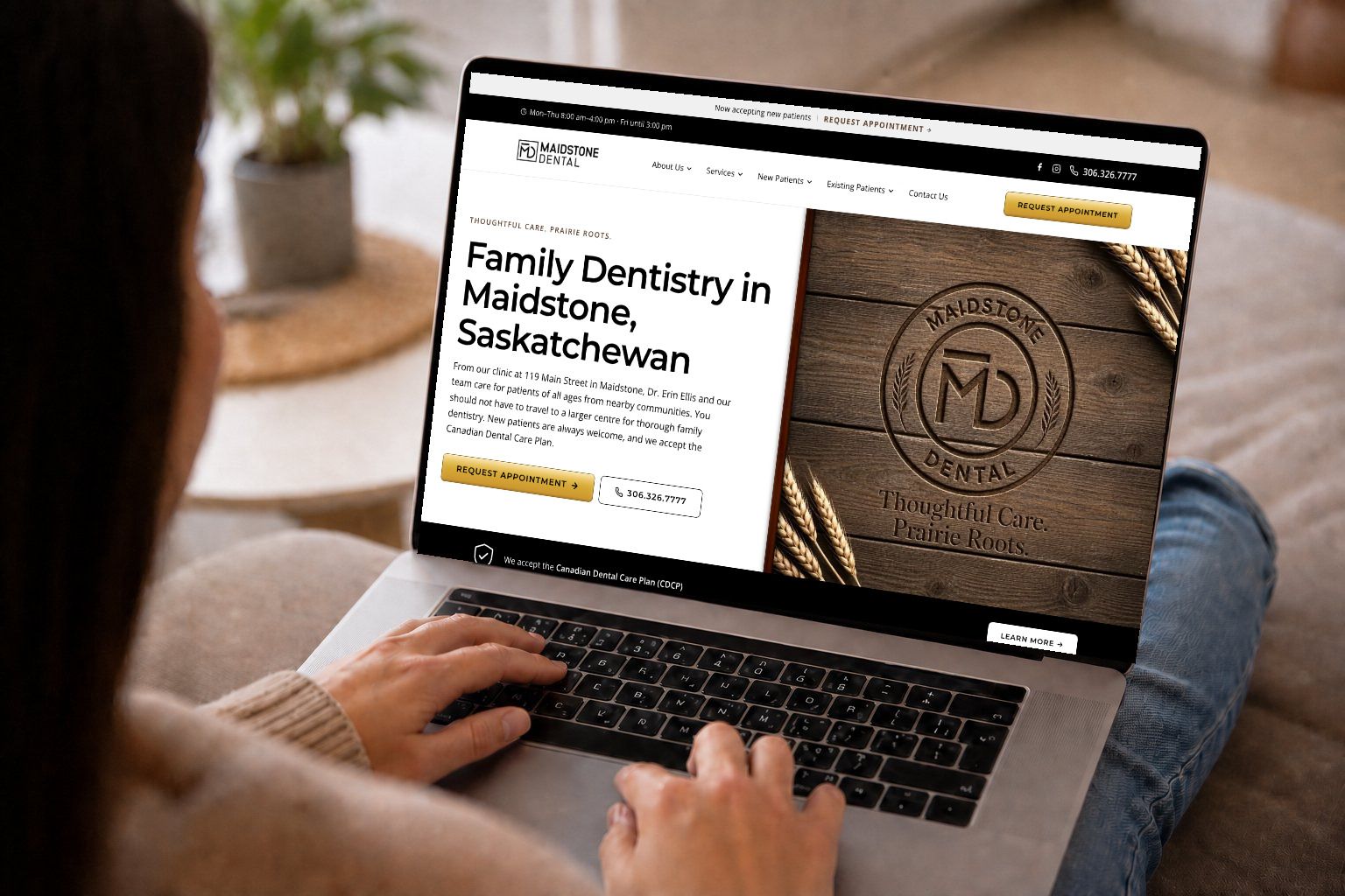 Person browsing the new Maidstone Dental homepage on a laptop