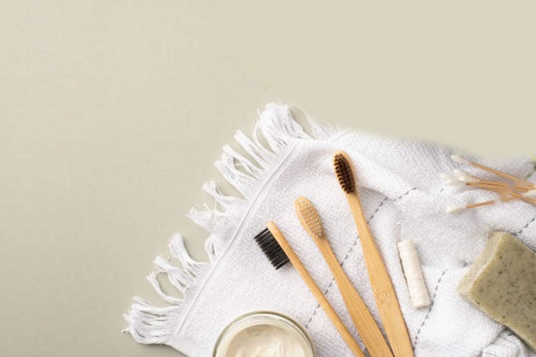 Natural oral care products on a linen towel